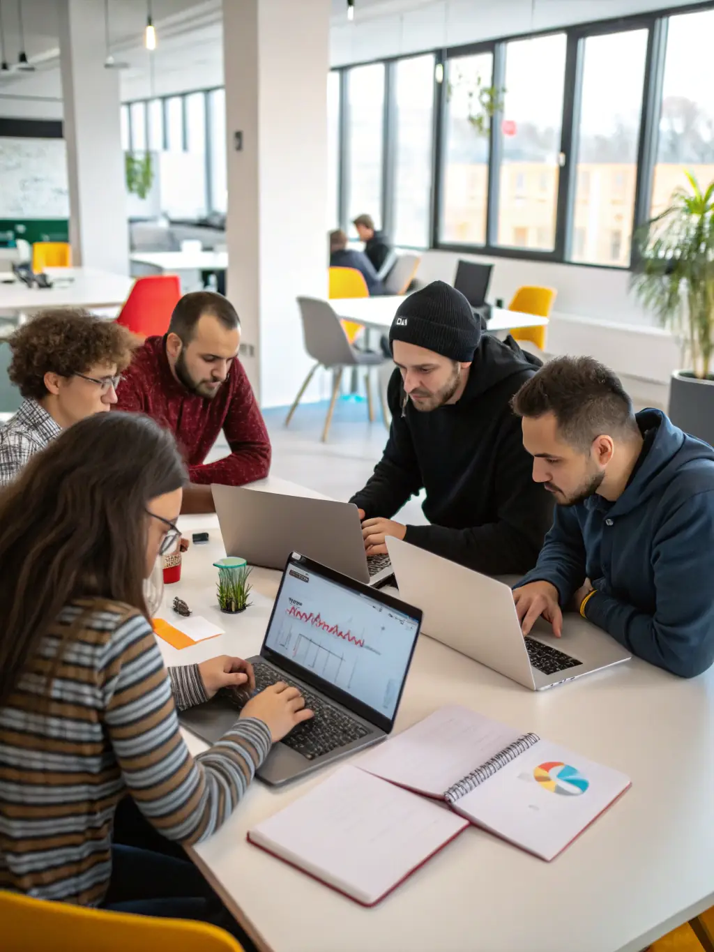 A diverse team of developers collaborating on a software project, symbolizing Rmms One's commitment to innovation and expertise.